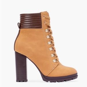 Heeled hiking boots. Never worn brand new out. In the box.